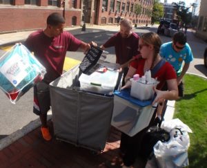 Olympia movers man the Give 'N Go stations at Bentley University